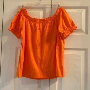 Bright orange blouse